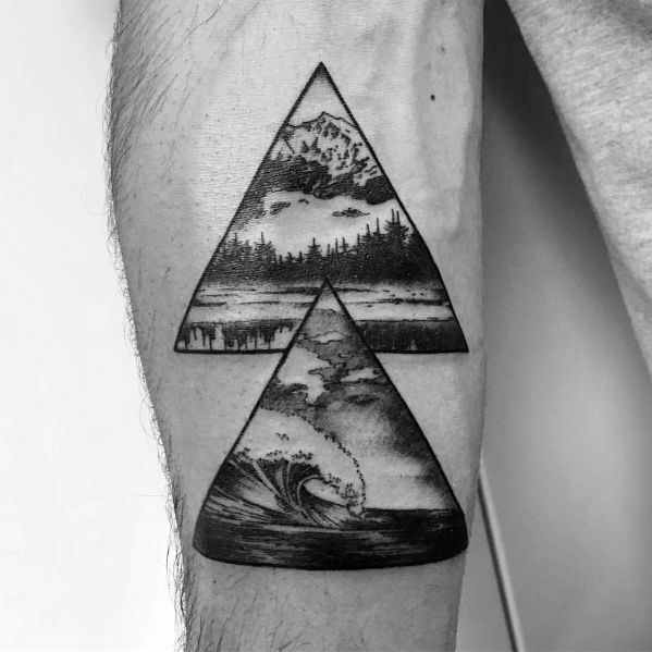 Black ink tattoo with two stacked triangles, featuring a detailed mountain landscape on top and a powerful crashing wave below, symbolizing balance.