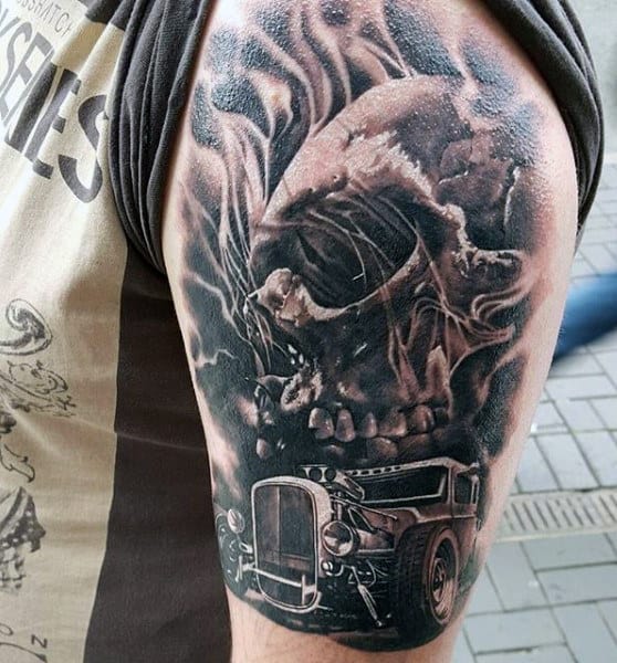 A detailed arm tattoo depicting a fierce wolf and a vintage car in grayscale style