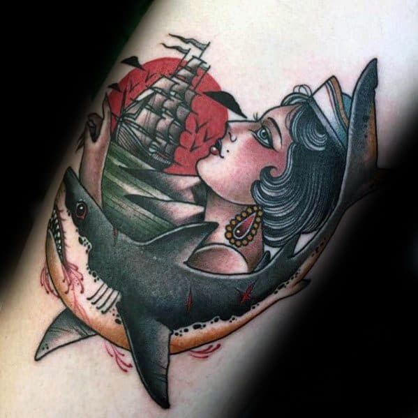 Neo-traditional tattoo featuring a shark, a woman in sailor attire, and a ship with red roses, all framed in a bold circular layout.