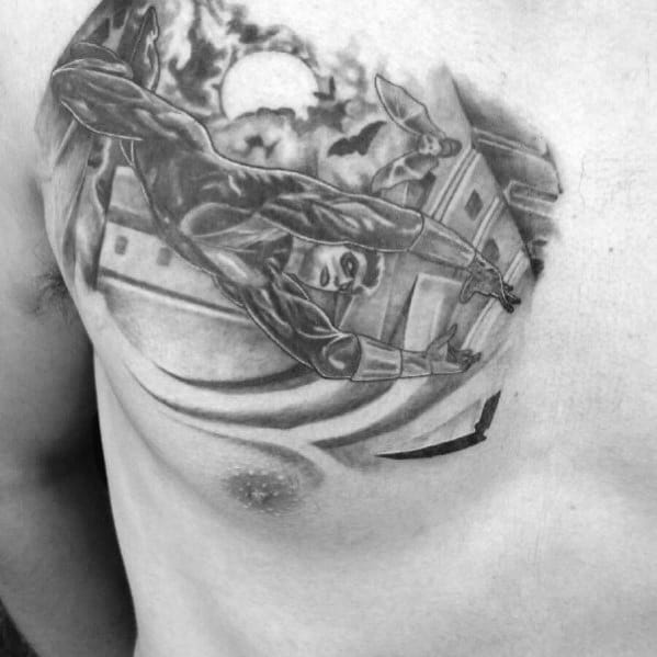 Black and gray chest tattoo of Nightwing leaping across rooftops under a full moon, capturing a dynamic and stealthy night scene.