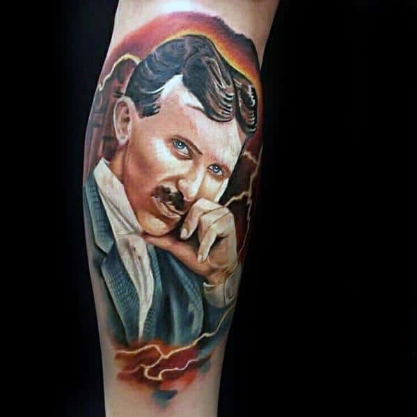 Vibrant color tattoo of Nikola Tesla in a thoughtful pose with glowing blue eyes and electric storm elements in the background.