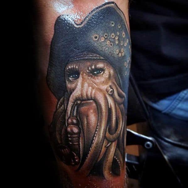 Realistic Davy Jones tattoo featuring his iconic tentacled face, piercing eyes, and detailed pirate hat for a bold, lifelike design