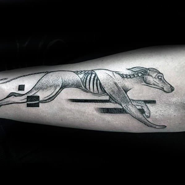 A striking tattoo of a greyhound in full sprint, with its skeletal structure visible, paired with abstract geometric shapes that emphasize motion and energy.