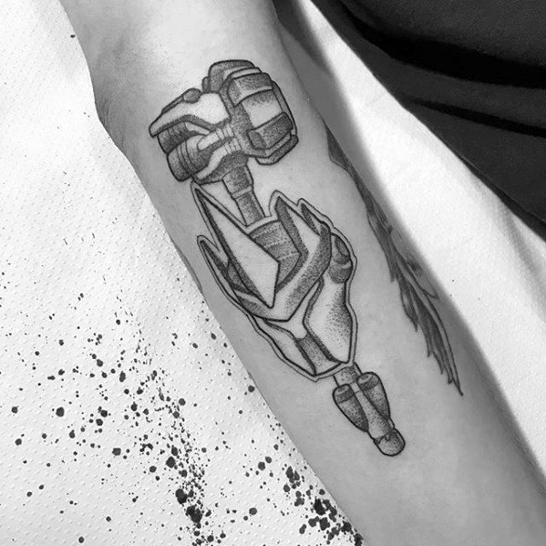 Black and grey linework tattoo of Genji’s dragonblade pose from Overwatch, placed on the inner forearm.