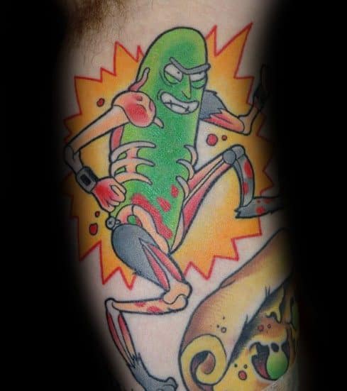 Pickle Rick cyborg tattoo with a dynamic pose, bold colors, and an explosive background, creating a high-energy design on the leg.