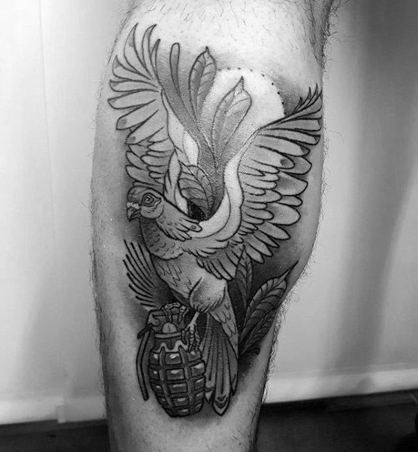 Bold blackwork tattoo of a pigeon in flight holding a grenade, blending themes of peace and conflict in a powerful symbolic design.
