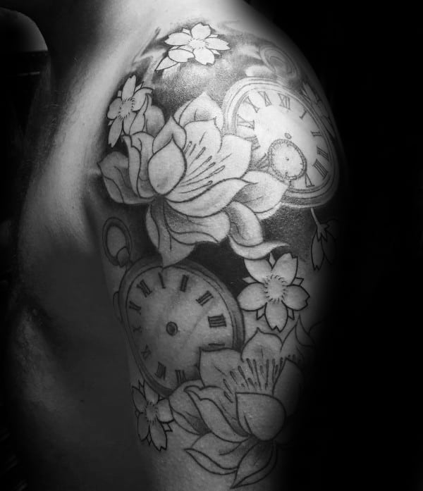 Black and grey half-sleeve tattoo featuring detailed pocket watches, blooming cherry blossoms, and soft shading for a timeless design