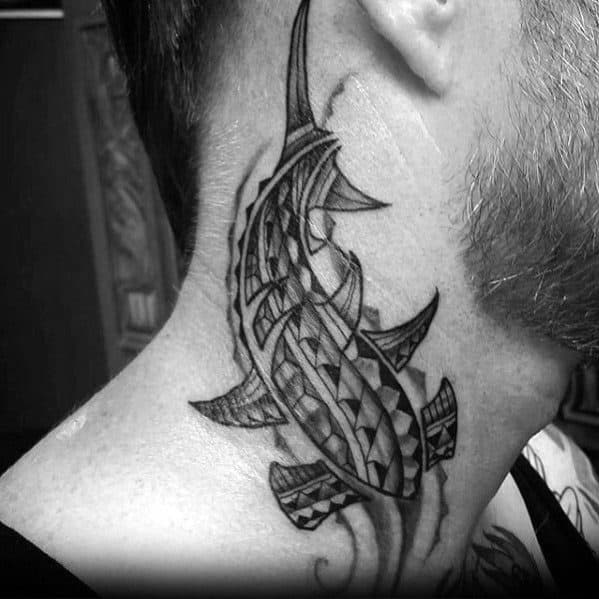 Polynesian shark tattoo on neck with intricate tribal details symbolizing strength, awareness, and spiritual protection from the ocean.