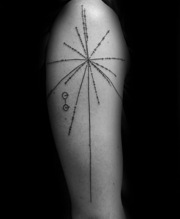Black and white tattoo of the Pioneer Plaque with a Pulsar Map on an upper arm, featuring cosmic lines and figures