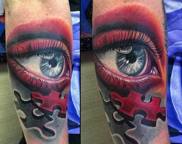 Mens Puzzle Pieces Tattoos Of Red Eye On Outer Forearm