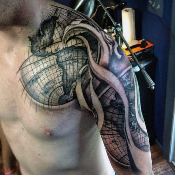 Man with a world map and compass shoulder tattoo in a geometric style