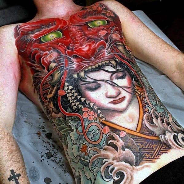 Full chest tattoo of a woman with a red tiger above her, covering torso and chest