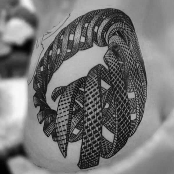 MC Escher-inspired tattoo of a twisted, woven ribbon loop forming a complex optical illusion with detailed geometric textures.