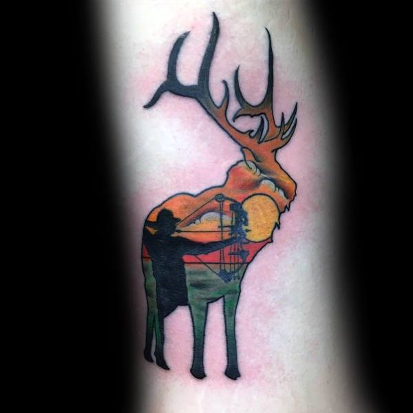 Colorful tattoo of a deer silhouette filled with a sunset scene of a bowhunter aiming, blending nature and hunting imagery in vibrant tones.