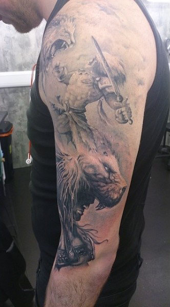 Detailed gladiator and lion tattoo sleeve on a person’s right arm