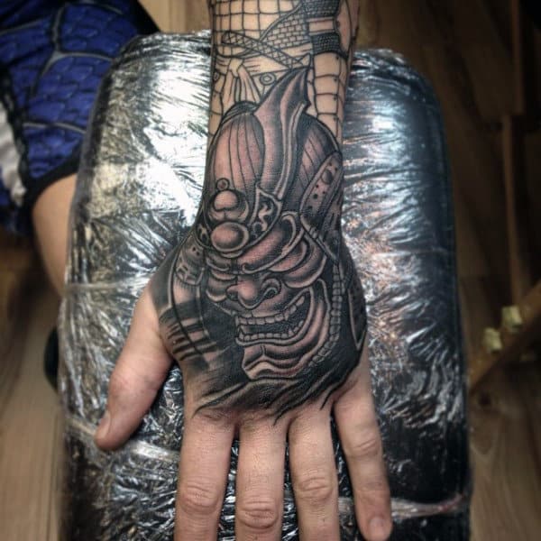 Mens Samurai Mask Shaded Black Work Tattoo On Hand