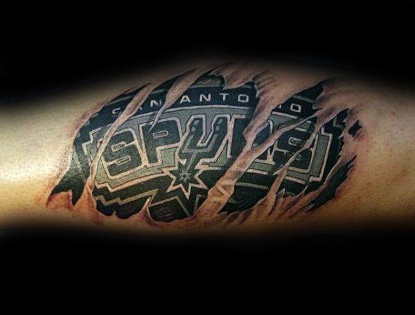 San Antonio Spurs logo tattoo designed to look like it's beneath torn skin, revealing bold black and gray lettering with a 3D effect.