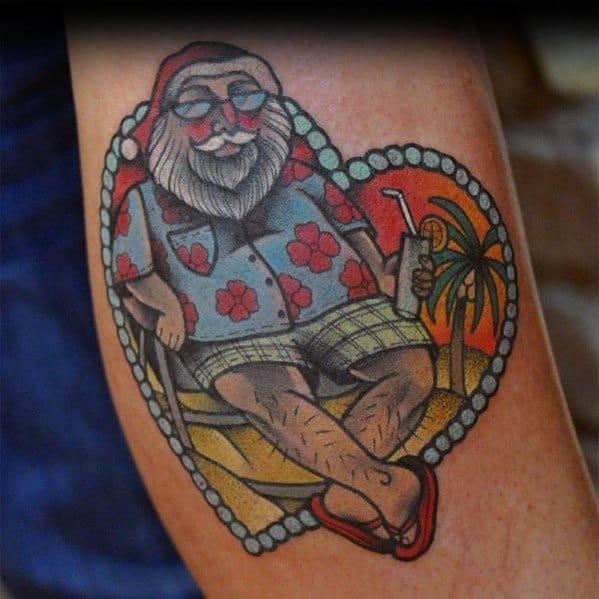 Tropical Santa Claus tattoo featuring him in a Hawaiian shirt, flip-flops, and sunglasses, relaxing with a drink on the beach at sunset.