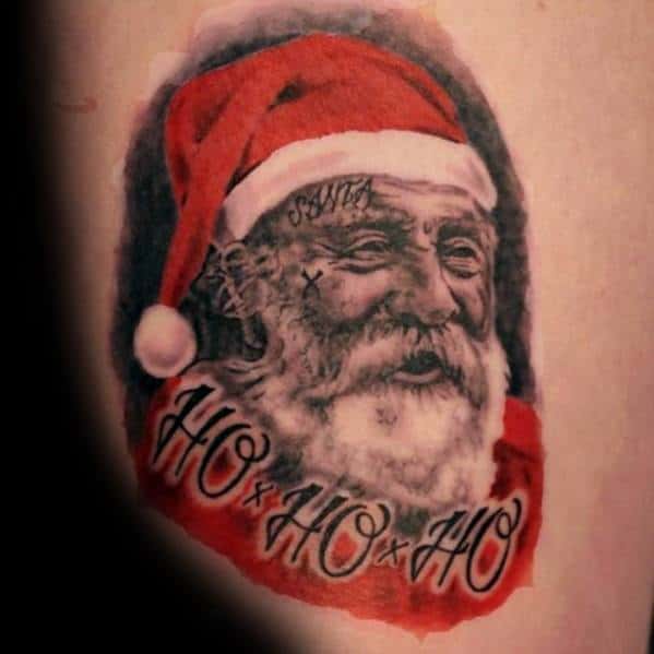 Edgy Santa Claus tattoo with a rugged, realistic look, featuring facial tattoos, detailed shading, and "Ho Ho Ho" script for a bold festive twist.