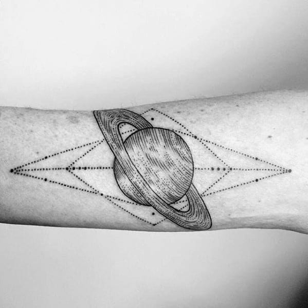 Geometric Saturn tattoo design for men with fine line shading and symmetrical dotted patterns forming a cosmic diamond layout.