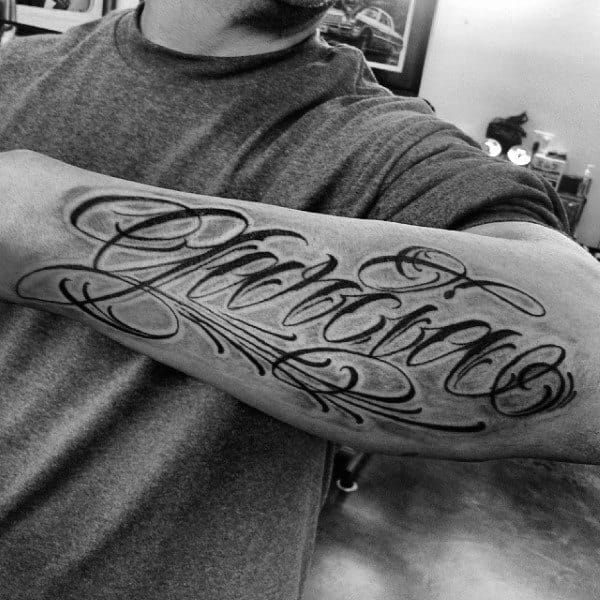 Mens Script Font Last Name Tattoo On Outer Forearm