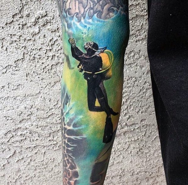 Vibrant scuba diver tattoo with a yellow tank, swimming toward the surface against a colorful underwater background.