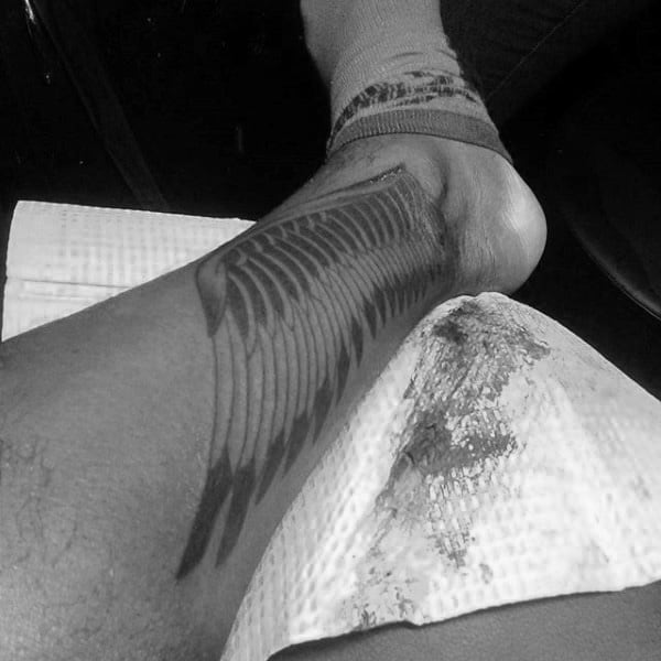 Mens Shaded Black And Grey Hermes Wing Tattoo Above Ankles