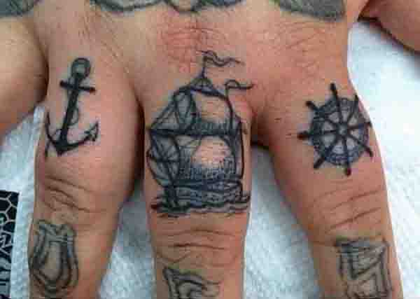 Mens Ships Wheel Tattoo On Fingers