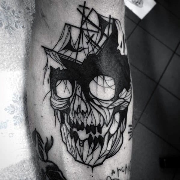 Abstract blackwork tattoo combining a shipwreck with a shattered skull, blending nautical and horror elements in a bold, graphic style.