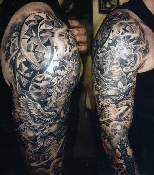 Arm with intricate, black and white fantasy-themed tattoos, including a unicorn