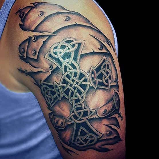 Detailed Celtic cross tattoo on upper arm