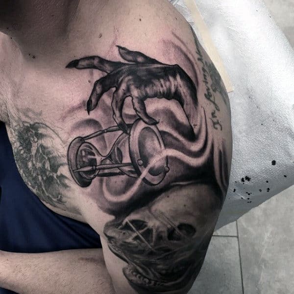 Mens Shoulder Hand Dropping Hourglass Tattoo Design Ideas