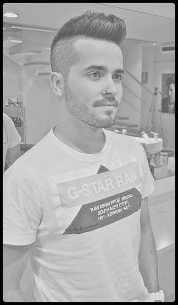 High, voluminous top with a sharp undercut and clean fade