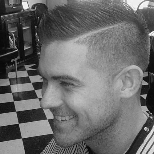 Modern side part with a hard part and a high fade