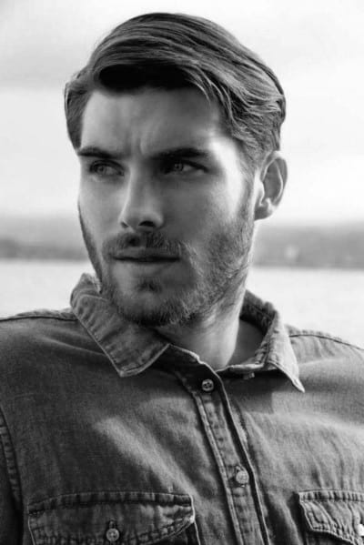 Medium-length, classic side part with a natural flow and light texture