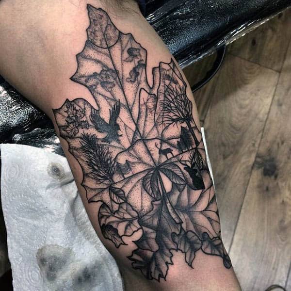 Mens Silhouett Of Animals In The Woods Leaf Tattoo On Arm