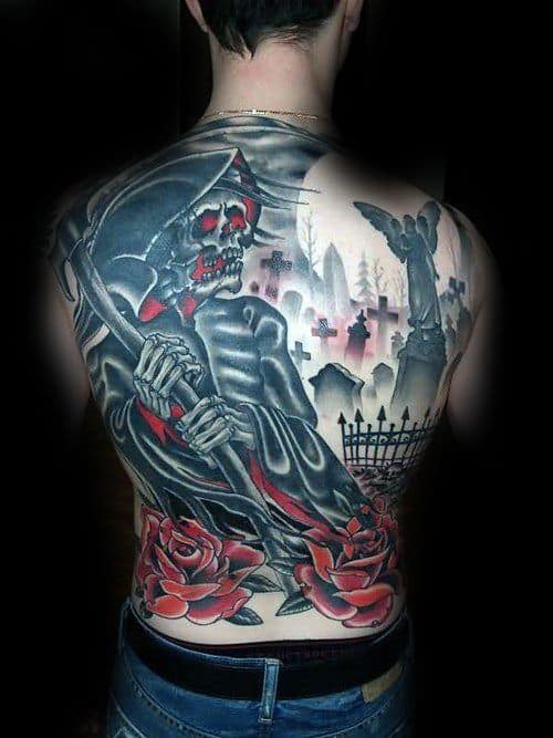Grim Reaper back tattoo with red-eyed skull, graveyard scene, and red roses, blending death and beauty in a bold color palette.