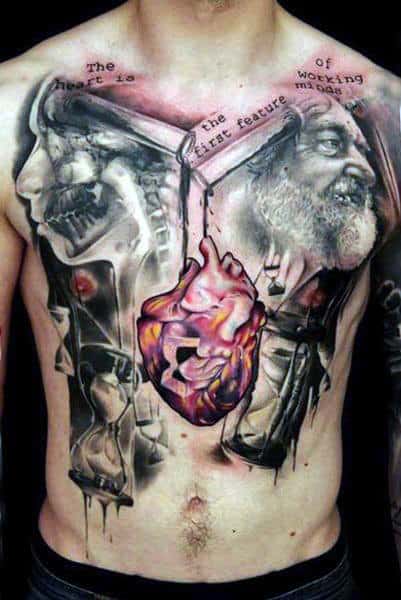Chest tattoo featuring a human heart, skulls, and faces in a surreal, dark style