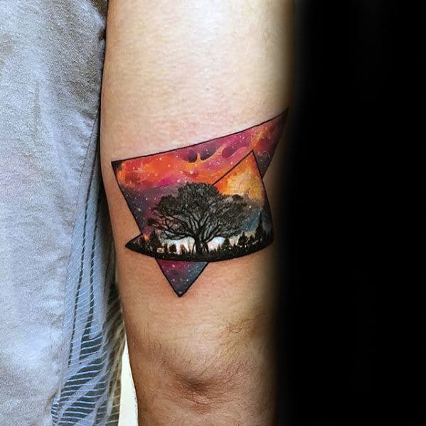 mens-small-outer-space-sky-with-tree-tricep-tattoo
