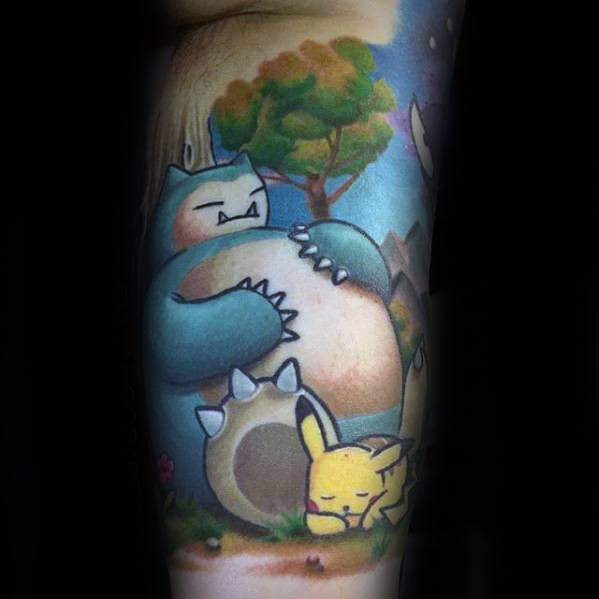 Snorlax and Pikachu tattoo with a peaceful forest scene, showing Pikachu napping against Snorlax’s belly under a tree.