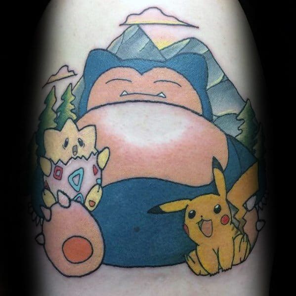 Snorlax tattoo with Pikachu and Togepi in a scenic mountain setting, all smiling in a peaceful and colorful design.