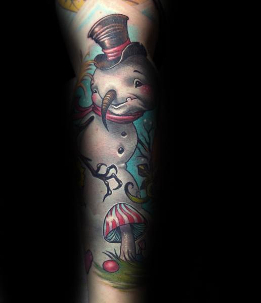 Whimsical snowman tattoo with a curved carrot nose, a playful grin, a top hat, and a magical forest setting with mushrooms and swirling details.