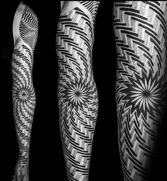 Arm tattoo with intricate geometric patterns radiating outward in a hypnotic design