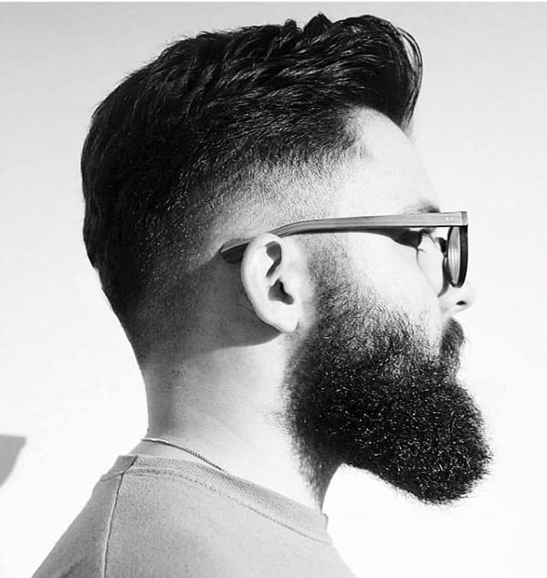 Undercut hairstyle with medium length beard