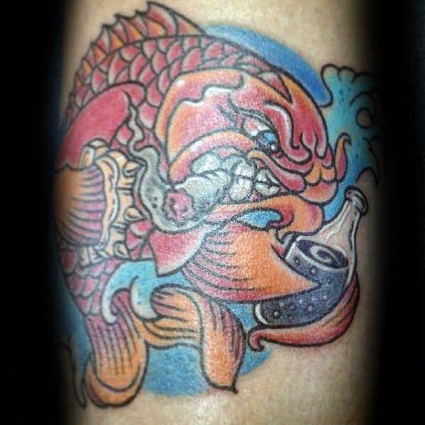 Bold, colorful tattoo of a fierce koi fish smoking and holding a bottle, surrounded by blue waves and stylized details.
