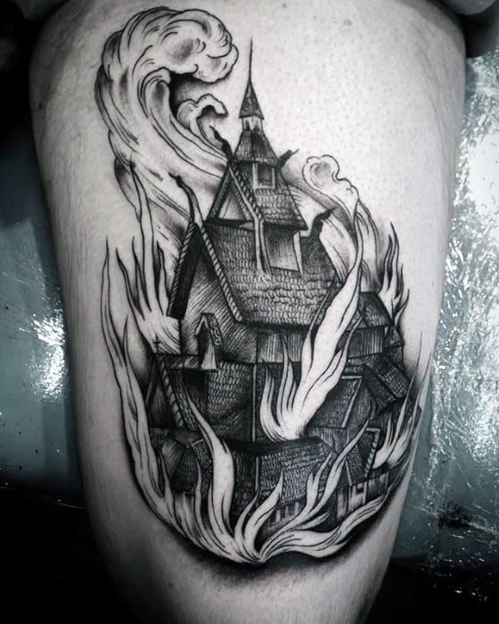 Detailed black and grey tattoo of a burning wooden church with swirling flames and smoke. Intricate linework enhances the structure's texture.
