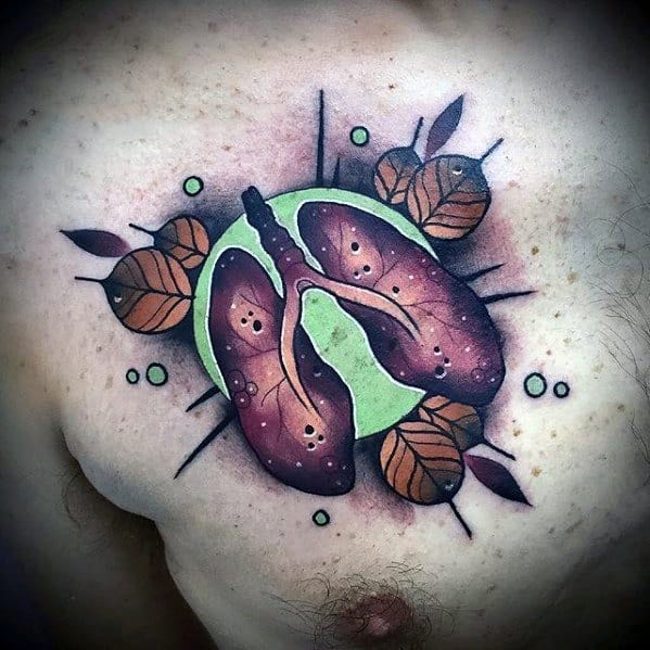 Colorful chest tattoo of human lungs over a green circle, surrounded by abstract leaves and dot accents for a nature-inspired design.