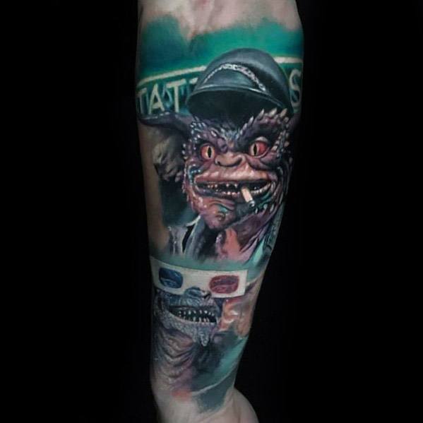Realistic Gremlin tattoo with a mischievous grin, wearing a hat and smoking, featuring a detailed 3D glasses reflection for a cinematic vibe.