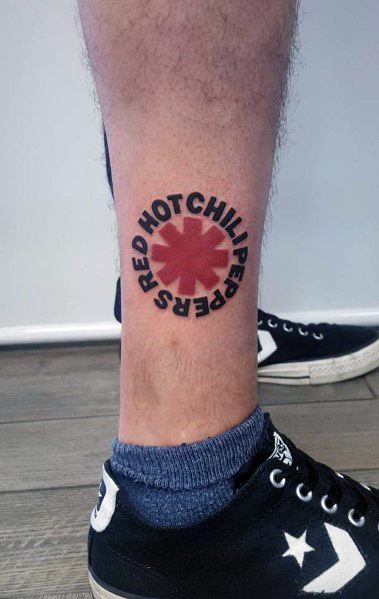 Ankle tattoo featuring the Red Hot Chili Peppers logo with bold black lettering circling the red emblem for a classic band tribute design.