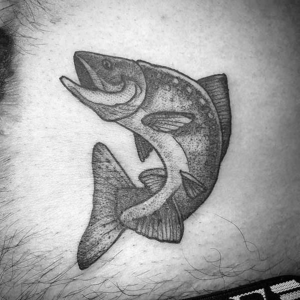 Black and grey tattoo of a leaping salmon with fine shading and dotwork, creating a detailed and realistic design on the skin.